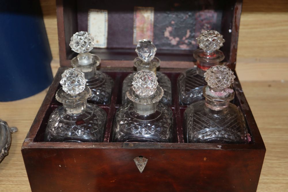 A Victorian plated cruet and a 19th century mahogany and mother of pearl inlaid decanter box, six fitted decanters, one associated stop